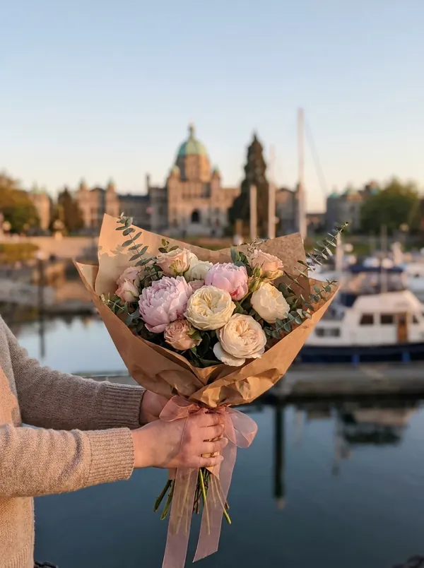Peony gift bouquet held at Victoria's Inner Harbour