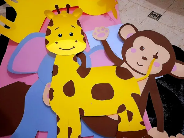 Handmade giraffe and monkey cut-outs, made by Kitty